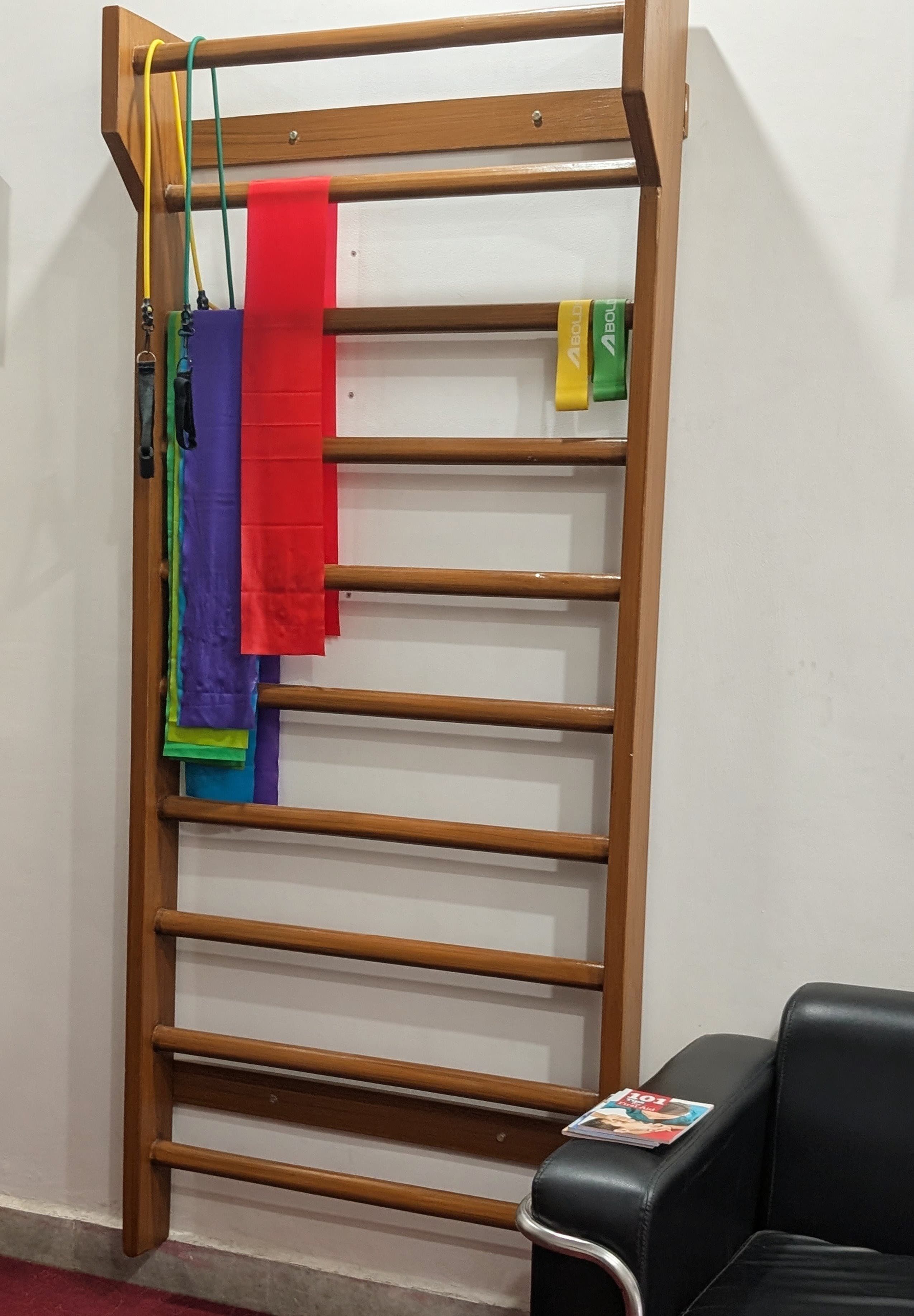 Rehabilitation wall bars and resistance bands at Trinay clinic
